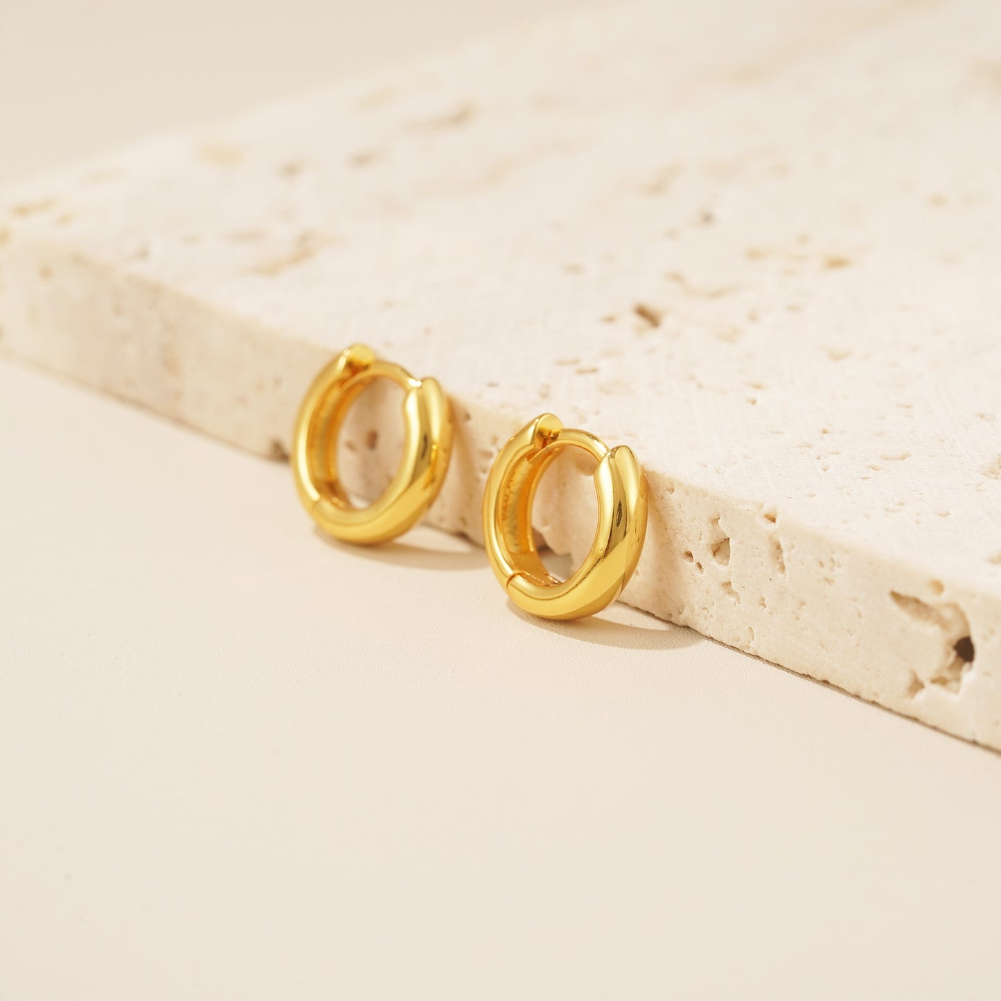 18 karat gold bold huggie hoop earrings