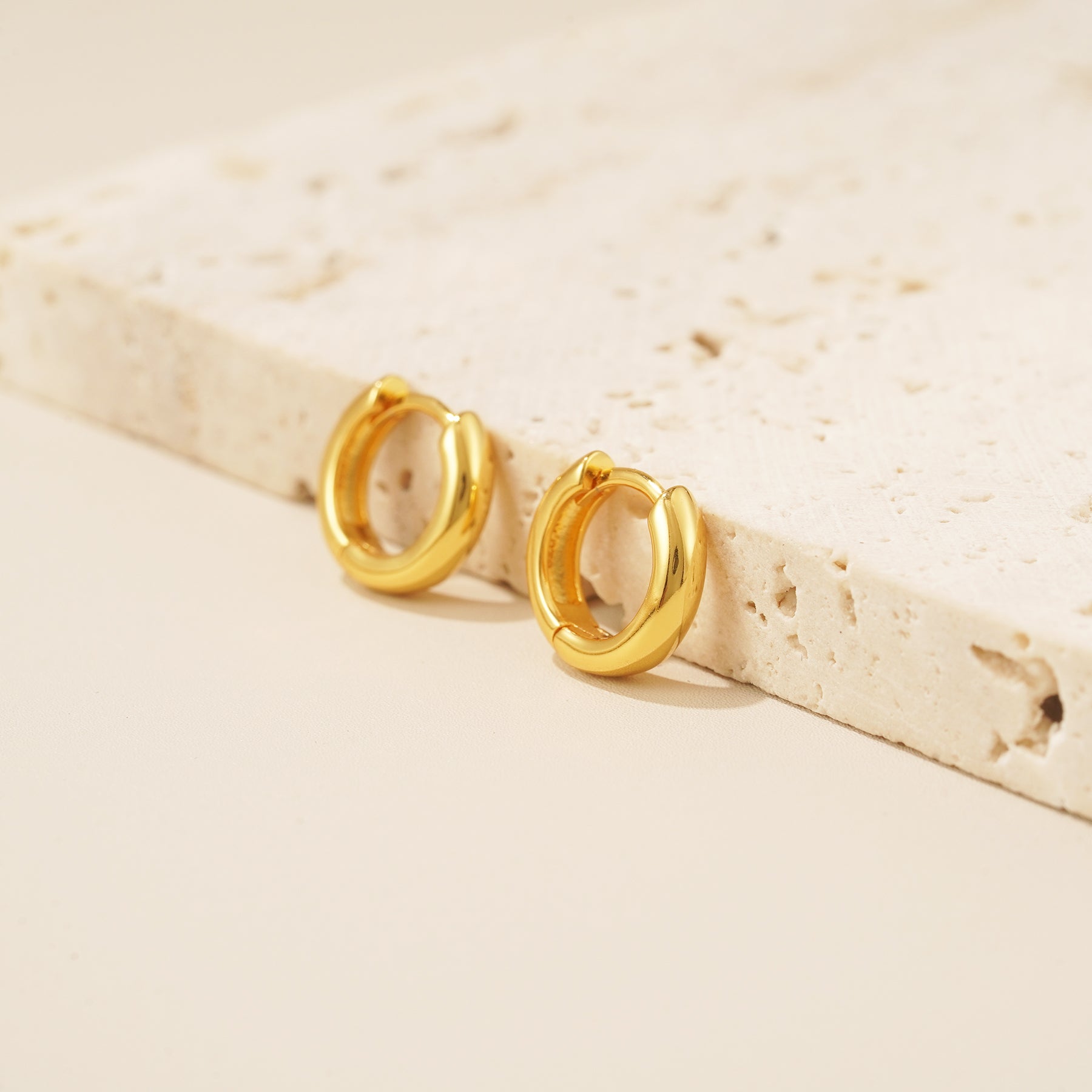 18 karat gold bold huggie hoop earrings