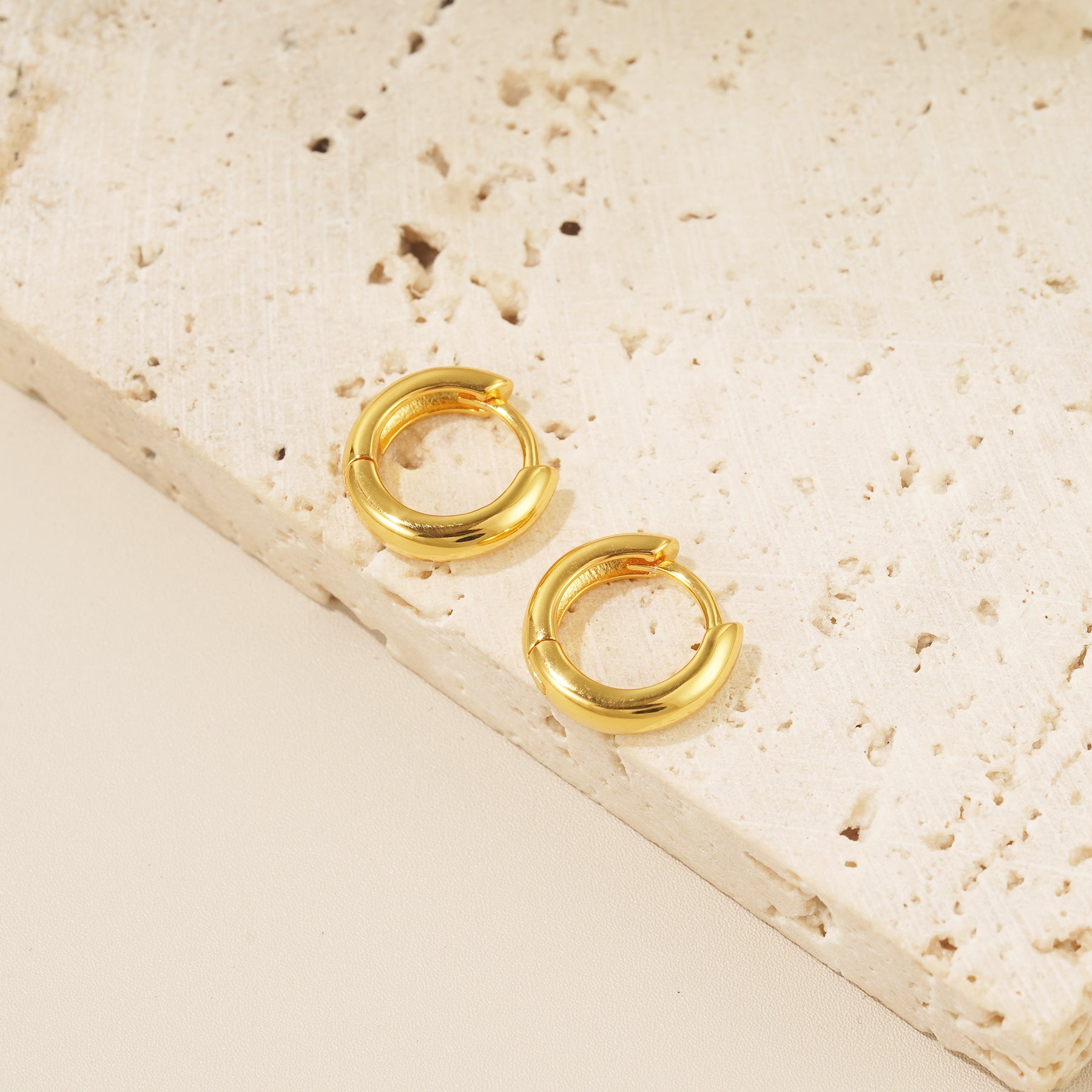 18 karat gold bold huggie hoop earrings