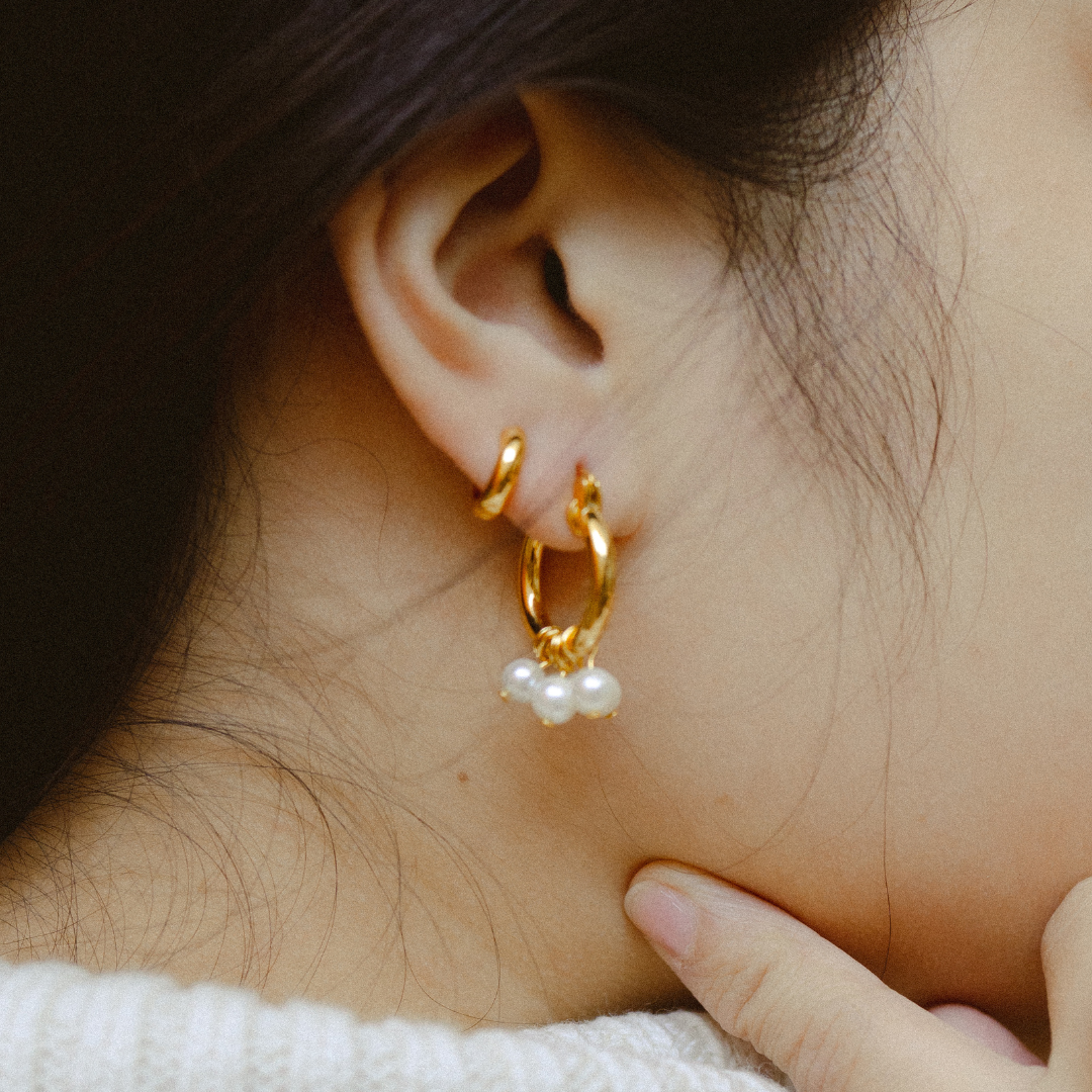 18 karat gold plated bold sterling silver huggie hoops and gold pearl hoop earrings