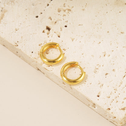 18 karat gold bold huggie hoop earrings 